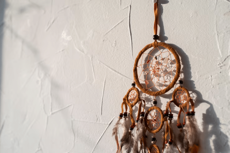 Boho bedroom wall with macramé hangings, woven baskets, and layered patterns.
