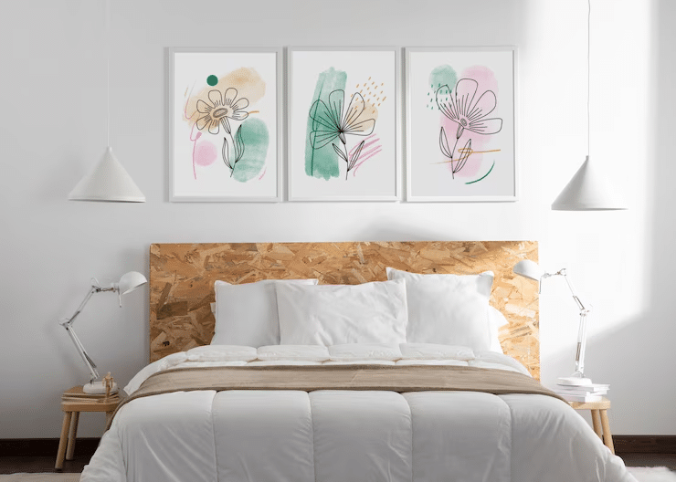Scandinavian bedroom with light wood panel walls and minimalist framed prints.