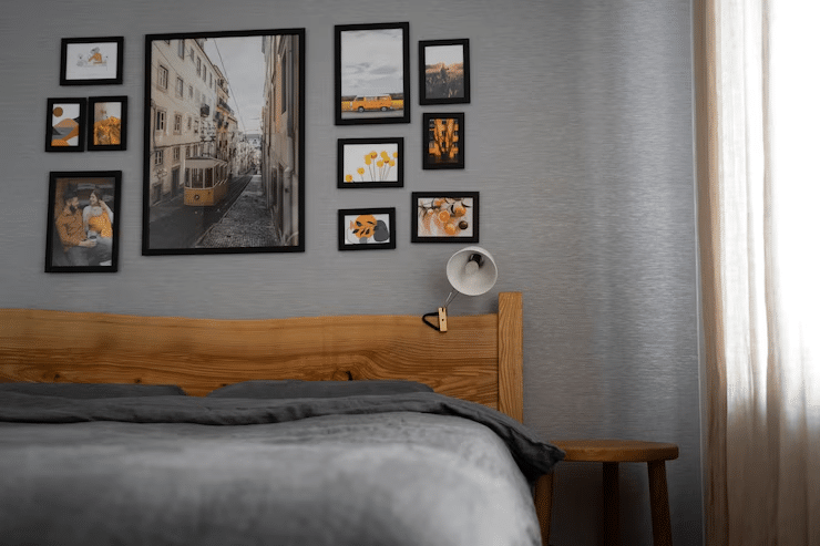 Gallery wall with framed art and family photos in cozy bedroom