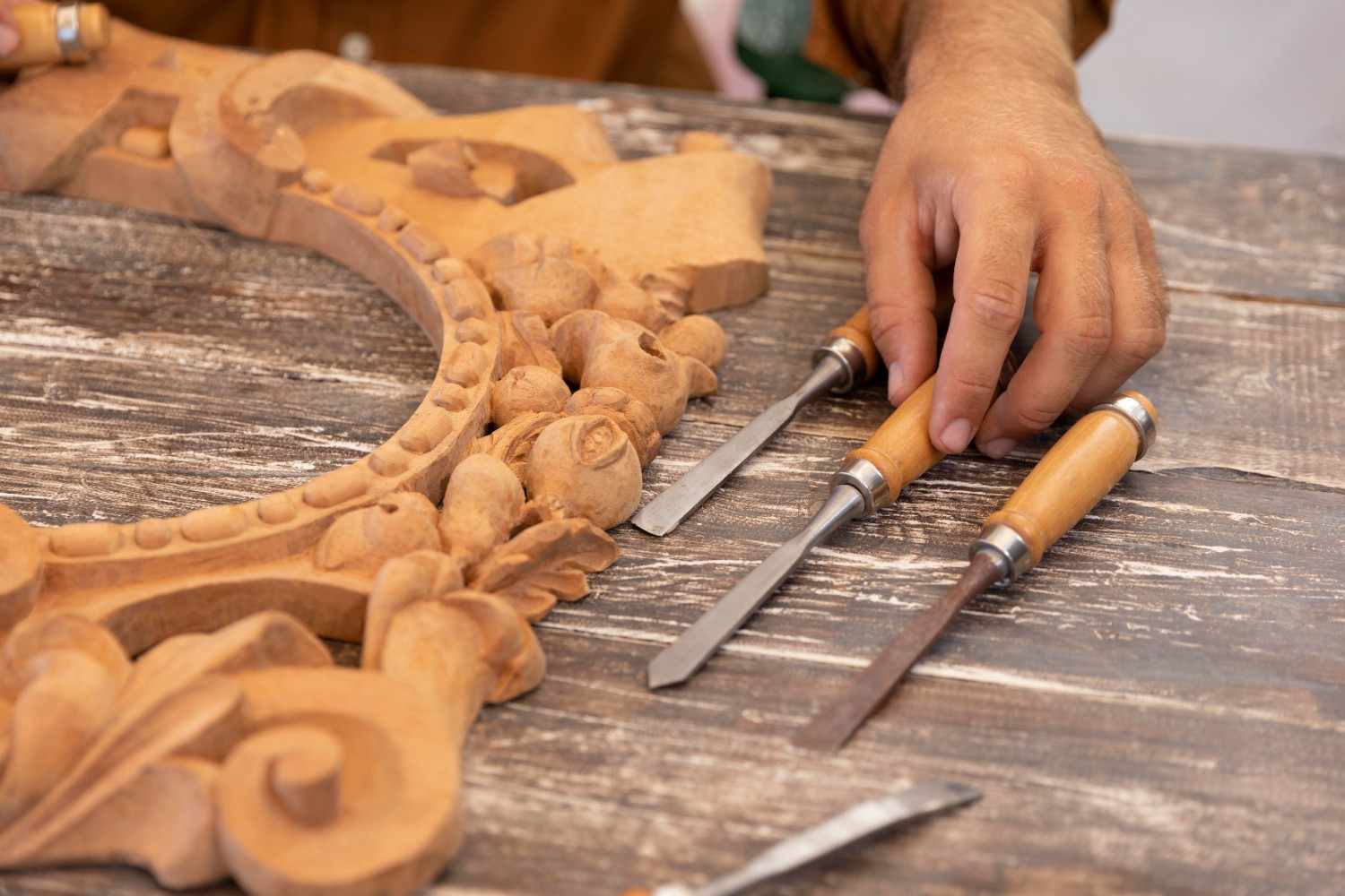 Traditional kitchen craftsmanship showing hand-carved wooden cabinet details in Bengaluru