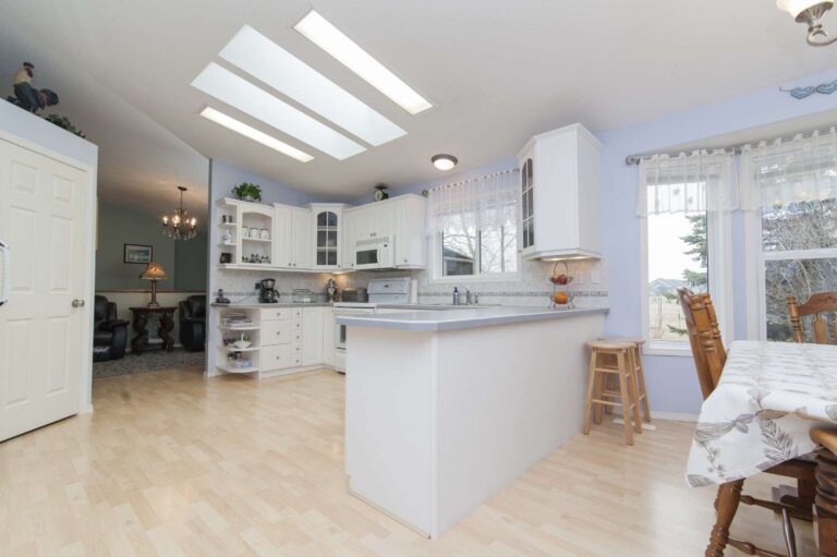 Luxury kitchen interior in Bangalore featuring custom cabinetry designed by Elegante Interiors showing MDF applications