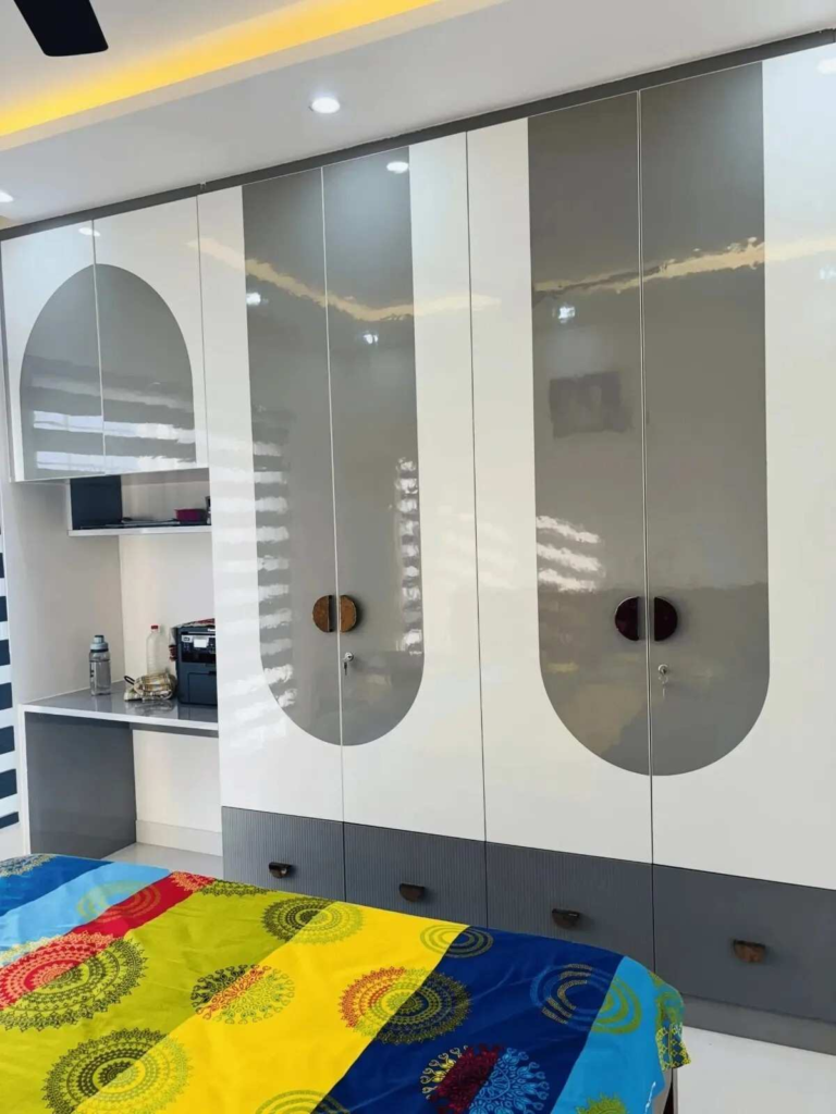 Modern bedroom wardrobe design with custom storage solutions and contemporary finish details