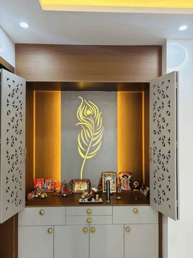 Contemporary pooja room design with traditional elements integrated lighting and custom storage solutions