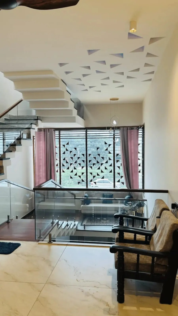 Warm and inviting living room interior with custom furniture and sophisticated color palette by Elegante Interiors