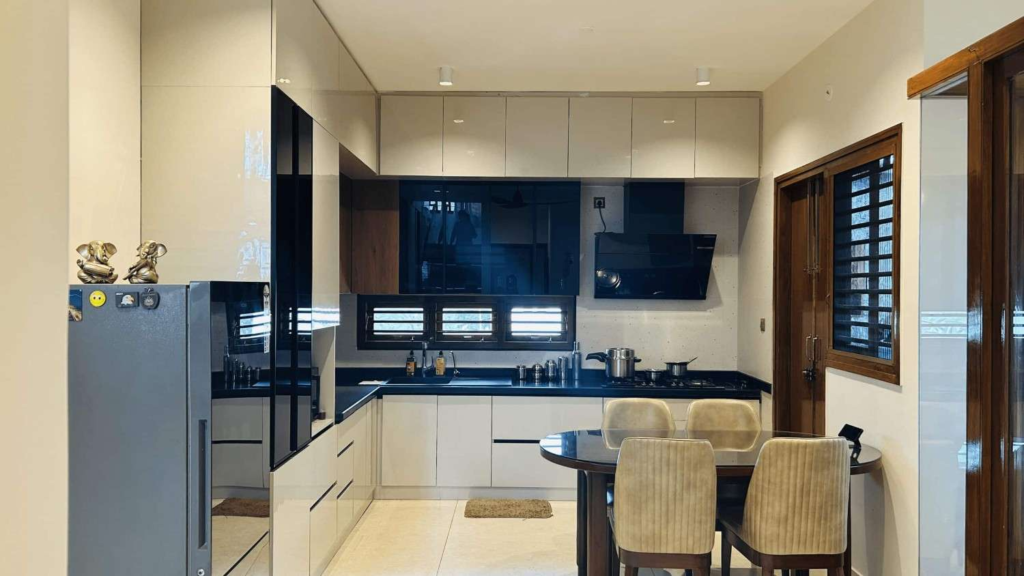 Contemporary modular kitchen with sleek cabinets and modern appliances designed by Elegante Interiors Bangalore