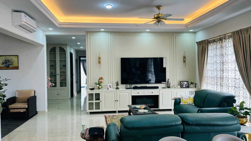 Modern entertainment room designed by Elegante Interiors with teal leather seating, custom built-in TV unit, and elegant lighting in Bangalore residence