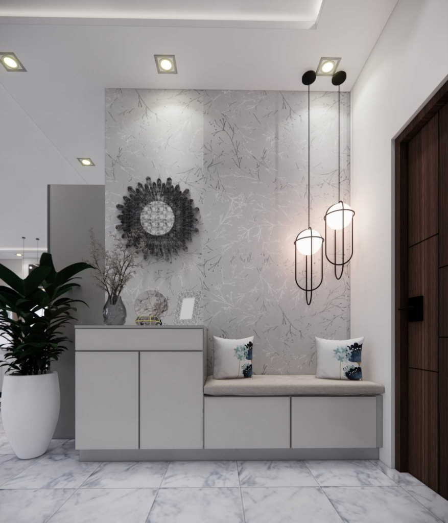 Elegant apartment entrance with built-in seating, decorative wall art, and modern pendant lights designed by Elegante Interiors