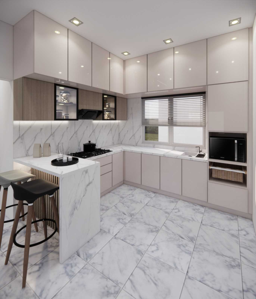 Modern L-shaped modular kitchen with marble countertops, pastel cabinetry, and breakfast counter designed by Elegante Interiors