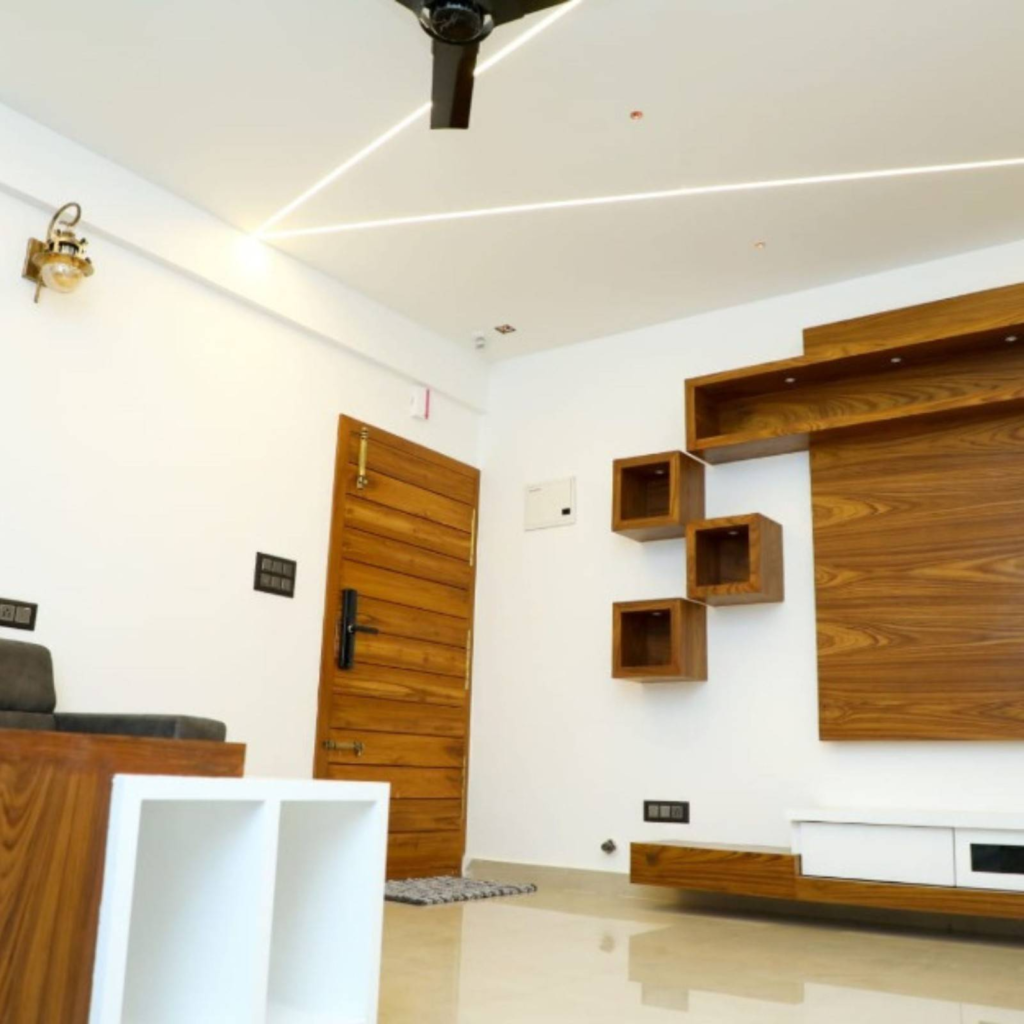 Contemporary living room interior design Bangalore with custom storage solutions - Elegante Interiors