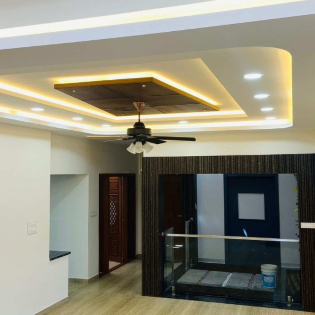 Luxury penthouse living room interior design with contemporary ceiling treatment - Elegante Interiors