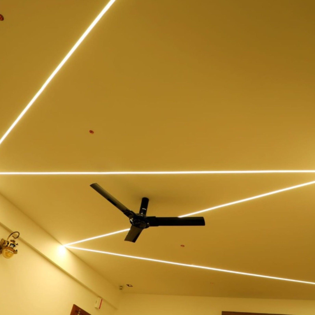 Modern false ceiling design with integrated LED lighting for Bangalore penthouse - Elegante Interiors