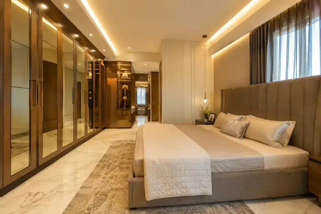 Elegante Interiors JP Nagar Road luxury villa master bedroom with custom wardrobe design and walk-in dressing area