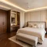 Luxury master bedroom interior design in Bangalore with custom wardrobe and cove lighting by Elegante Interiors